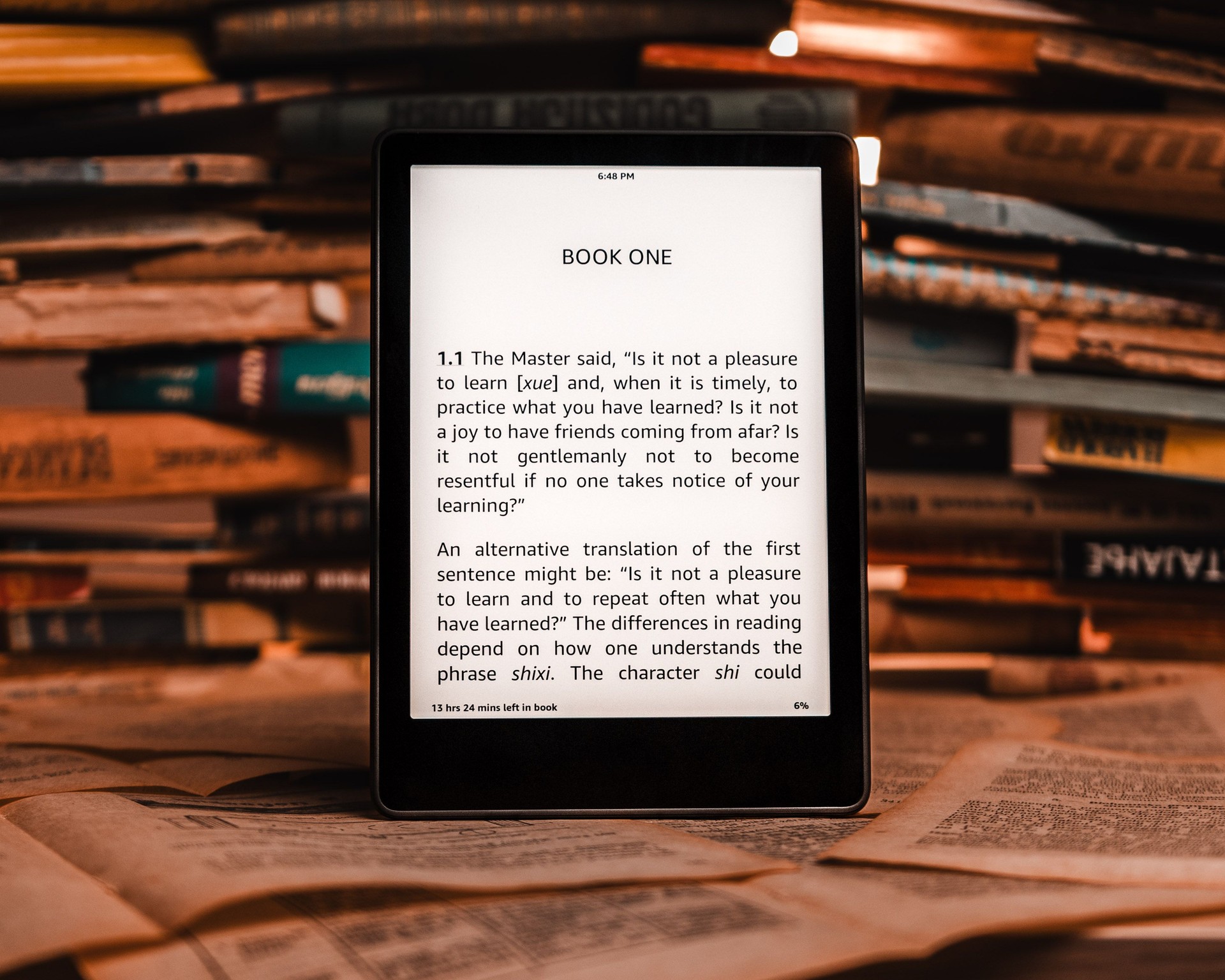 Ebook reader with books in the background