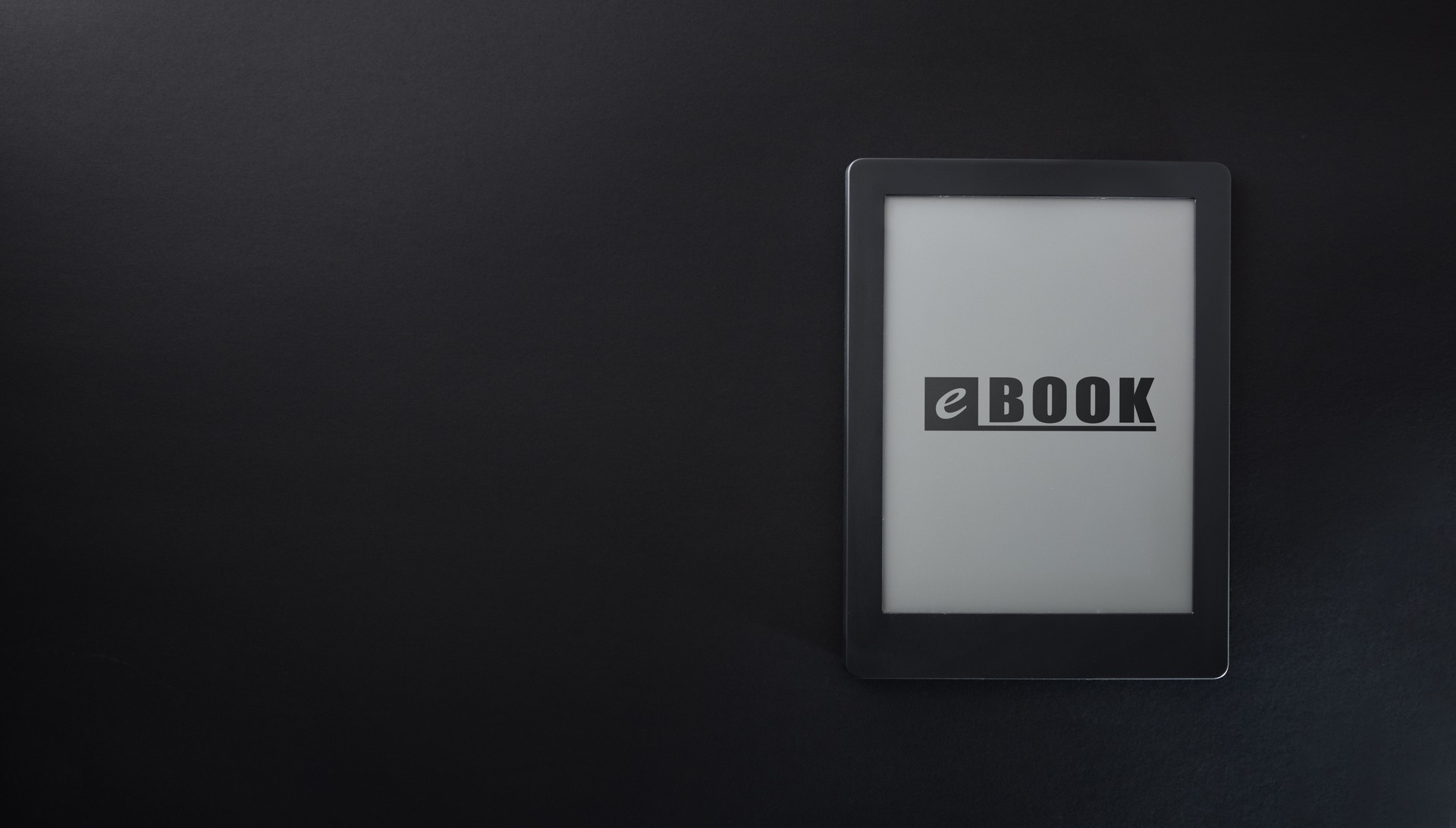 Ebook with text on screen isolated on black table